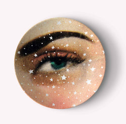 Starry pattern plate that has a green eye with an eyebrow 